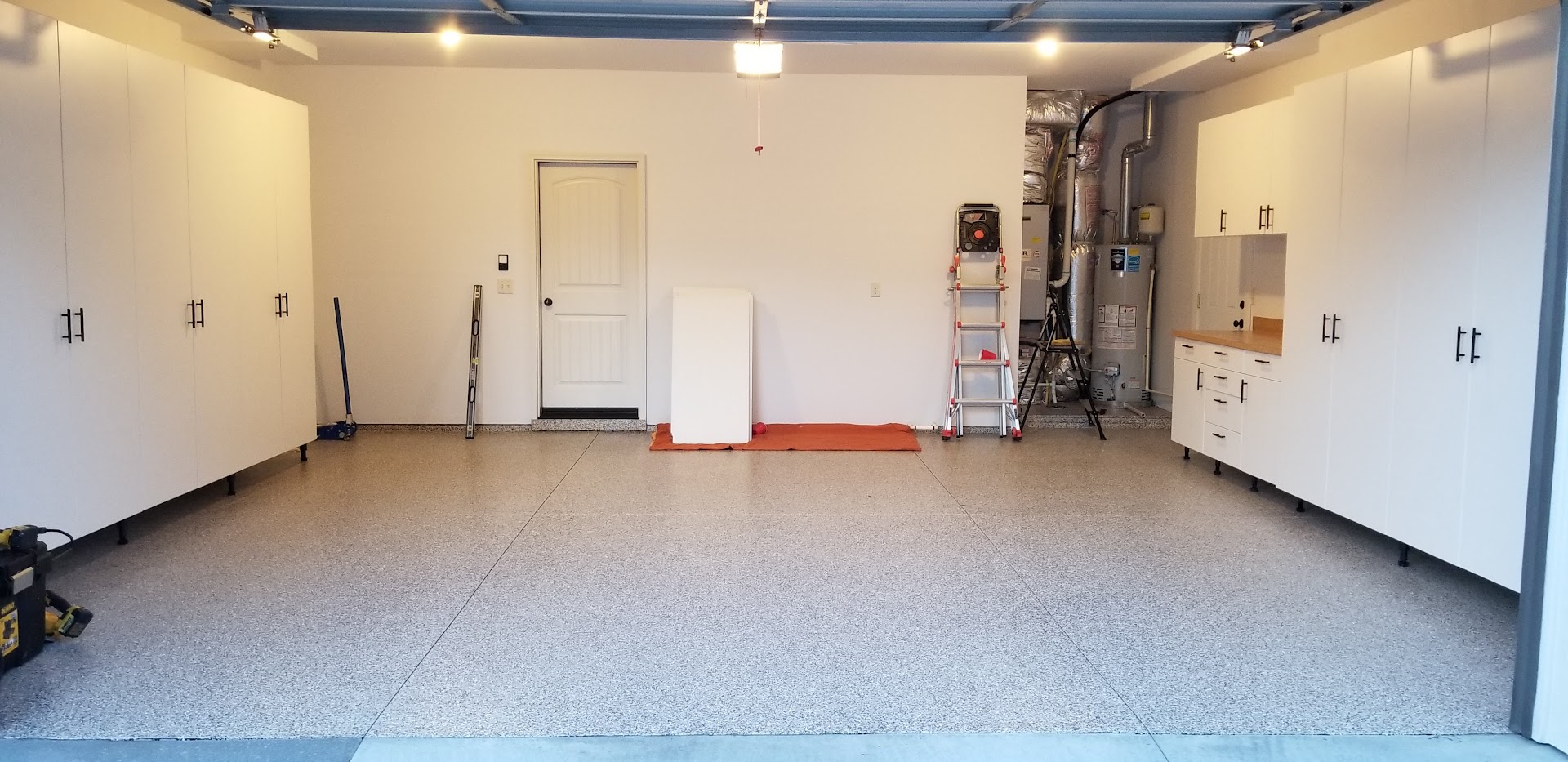 Boise Idaho Garage Upgrade: Epoxy + Polyaspartic Coating & Premium White Cabinets